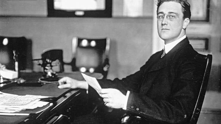 Young FDR at a desk