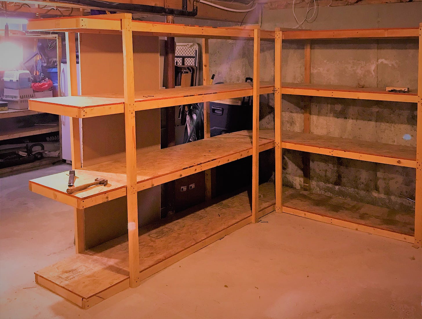 Bare wooden shelves in a basement.