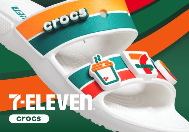 A Croc slide branded with 7-11 colors of green, orange, and red and 7-11-themed Jibbitz. WHY?