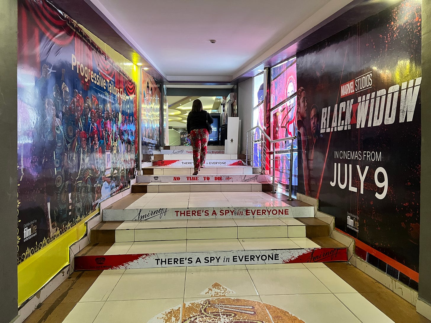 A walkway in the Filmhouse Surulere cinema with movie posters