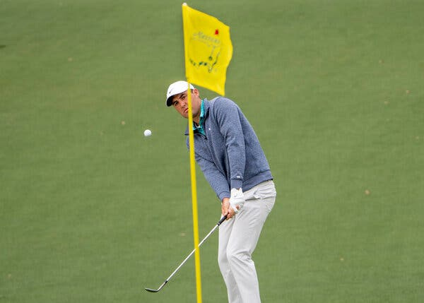 Scottie Scheffler chipped up to the second green for a birdie during the third round at Augusta National Golf Course on Saturday.