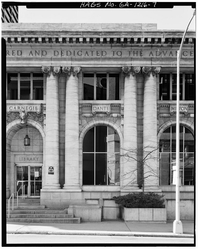 The former Carnegie Library in Atlanta, which was leveled in the 1970s. Portions of the library—including the marble friezes and cornices from the facade pictured here—are now scattered in a city dump. [Photograph courtesy of the Library of Congress…
