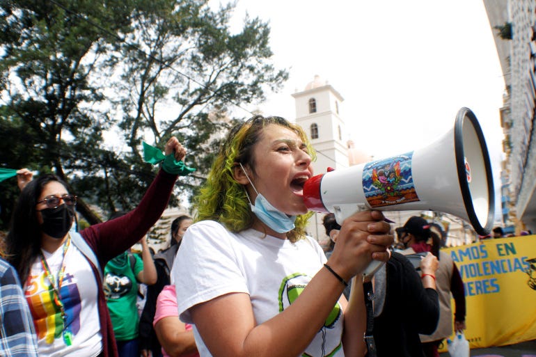 A woman speaks through a megaphone during a demonstration in favour of legalising abortion, after lawmakers approved a constitutional reform that would reinforce the ban, near the Congress in Tegucigalpa, Honduras January 25, 2021 [Fredy Rodriguez/Reuters]