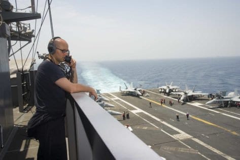 160724-N-QN175-011 ARABIAN GULF (July 24, 2016) – Seaman Kelcey Woodward mans the aft lookout watch station on vulture's row of the aircraft carrier USS Dwight D. Eisenhower (CVN 69) (Ike). Ike and its Carrier Strike Group are deployed in support of Operation Inherent Resolve, maritime security operations and theater security cooperation efforts in the U.S. 5th Fleet area of operations. (U.S. Navy photo by Mass Communication Specialist Seaman Dartez C. Williams/Released)