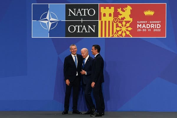 President Biden with the NATO secretary-general, Jens Stoltenberg, left, and Prime Minister Pedro Sánchez of Spain at the NATO summit in Madrid on Wednesday.
