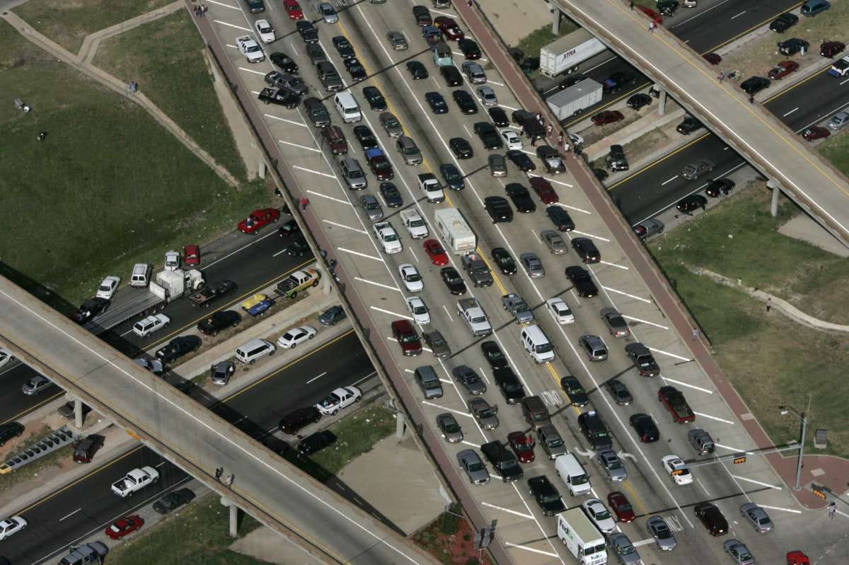 Cars jam interstate 45 and cross streets during the evacuation from Hurricane Rita Friday, Sept. 23, 2005, near Ennis, Texas. (Photo by Brett Coomer/Houston Chronicle) HOUCHRON CAPTION (10/06/2005) SECNEWS COLORFRONT: PARKING LOT: Hurricane Rita evacuees jam Interstate 45. About 96 percent of evacuees fled by car, and 18 percent of them headed north on I-45, making it the area's most-used freeway during the flight to safety. HOUCHRON CAPTION (10/17/2005) SECMETRO COLORFRONT: Officials offer ideas on controlling traffic bottlenecks like those during the Hurricane Rita evacuation.