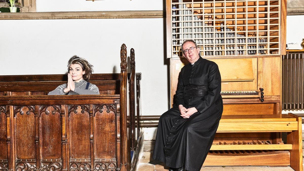 The Rev Richard Coles, 60, with Caitlin Moran at his church in Northamptonshire