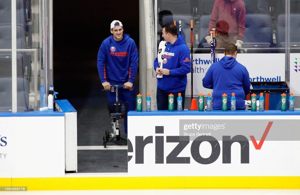 Injured player Ryan Pulock of the New York Islanders watches the team...  News Photo - Getty Images