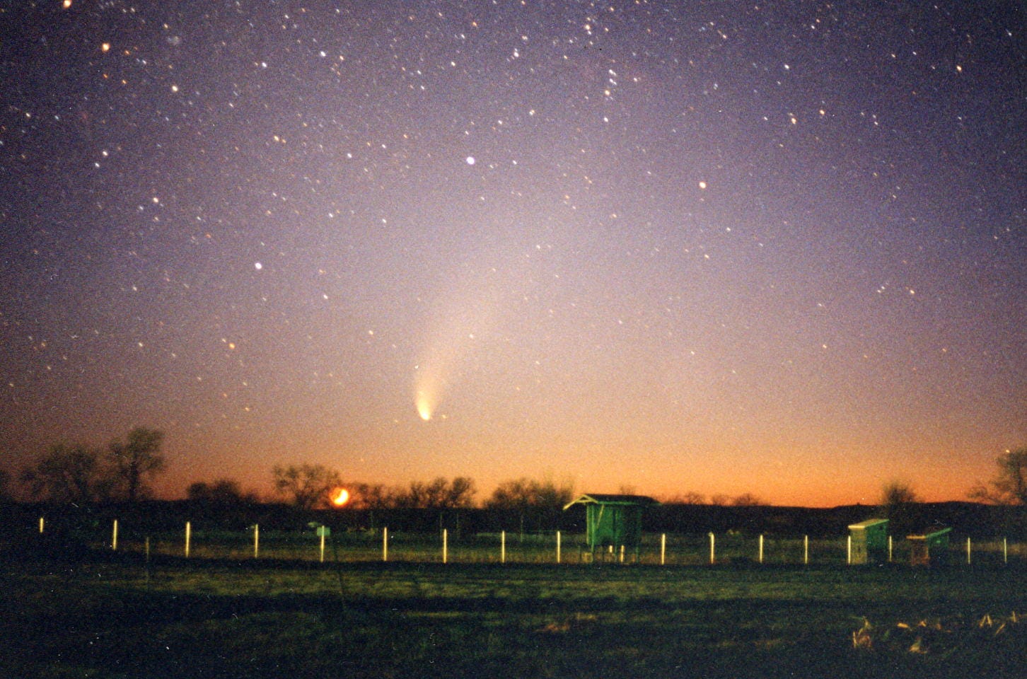 View of receding Comet Hale-Bopp with the setting crescent Moon, May 8, 1997. 