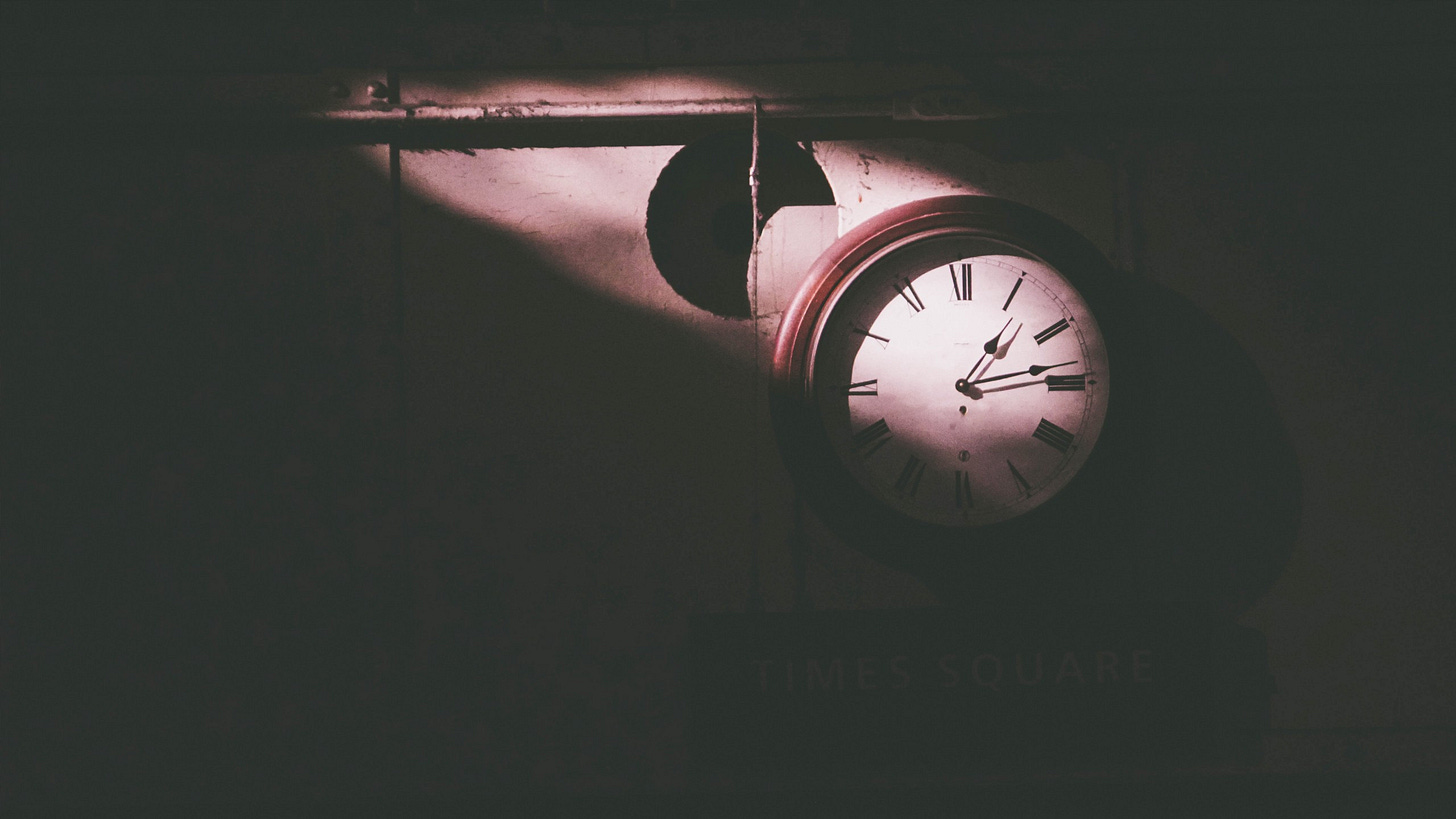 image of an old clock on the wall for article about time by Larry G. Maguire