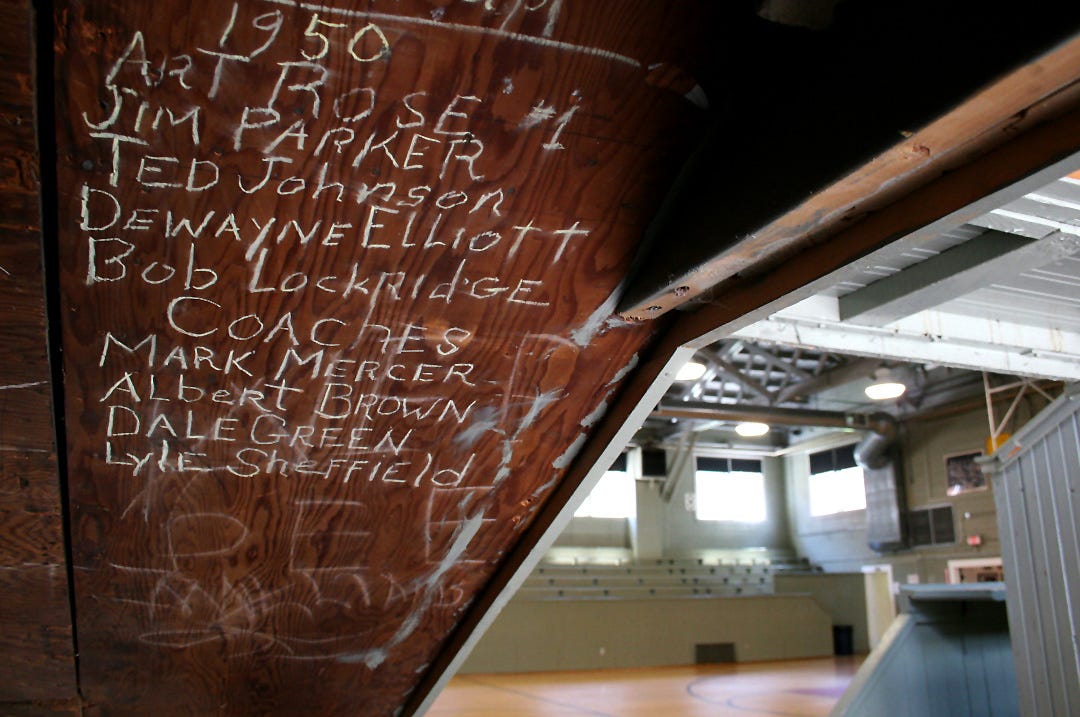 Now a central tourist attraction for Knightstown and Henry County, the Hoosier Gym, however, was once a modest high school gymnasium. Beneath the gym’s bleachers are the chalked-in names of guys who played for what were then the Knightstown High School Falcons.