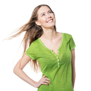 Beautiful smiling woman in green t-shirt looking up isolated on white
