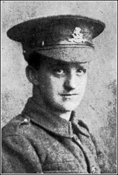 Head and shoulders press cutting portrait of Drummer Edgar Heald in army uniform jacket and peaked cap.