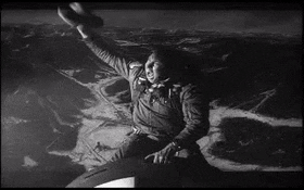 Gif of Slim Pickens as Major T. J. "King" Kong in Dr. Strangelove, yee-hawing wildly from a falling nuclear bomb. 