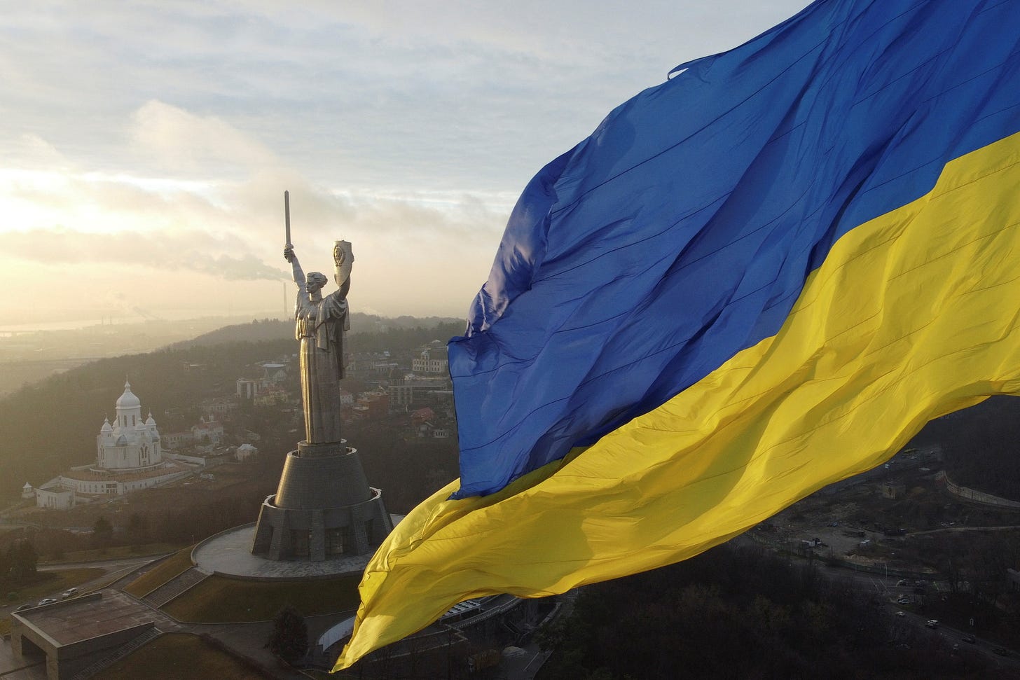 We fear no one:&quot; Ukrainians raise flags to defy Russia invasion fear |  Reuters