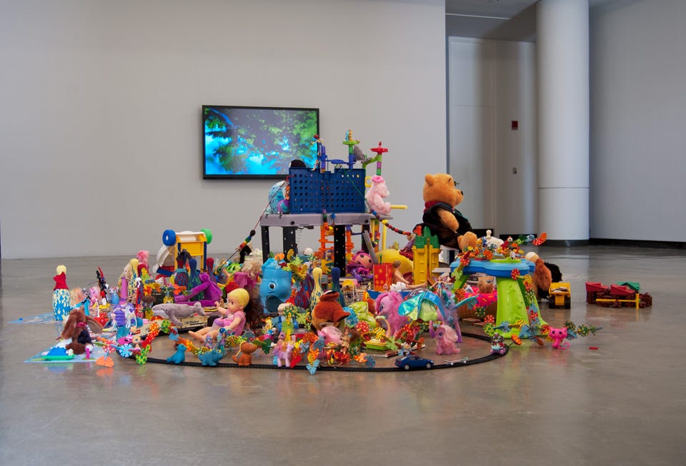 Donated toys piled up in the middle of a room