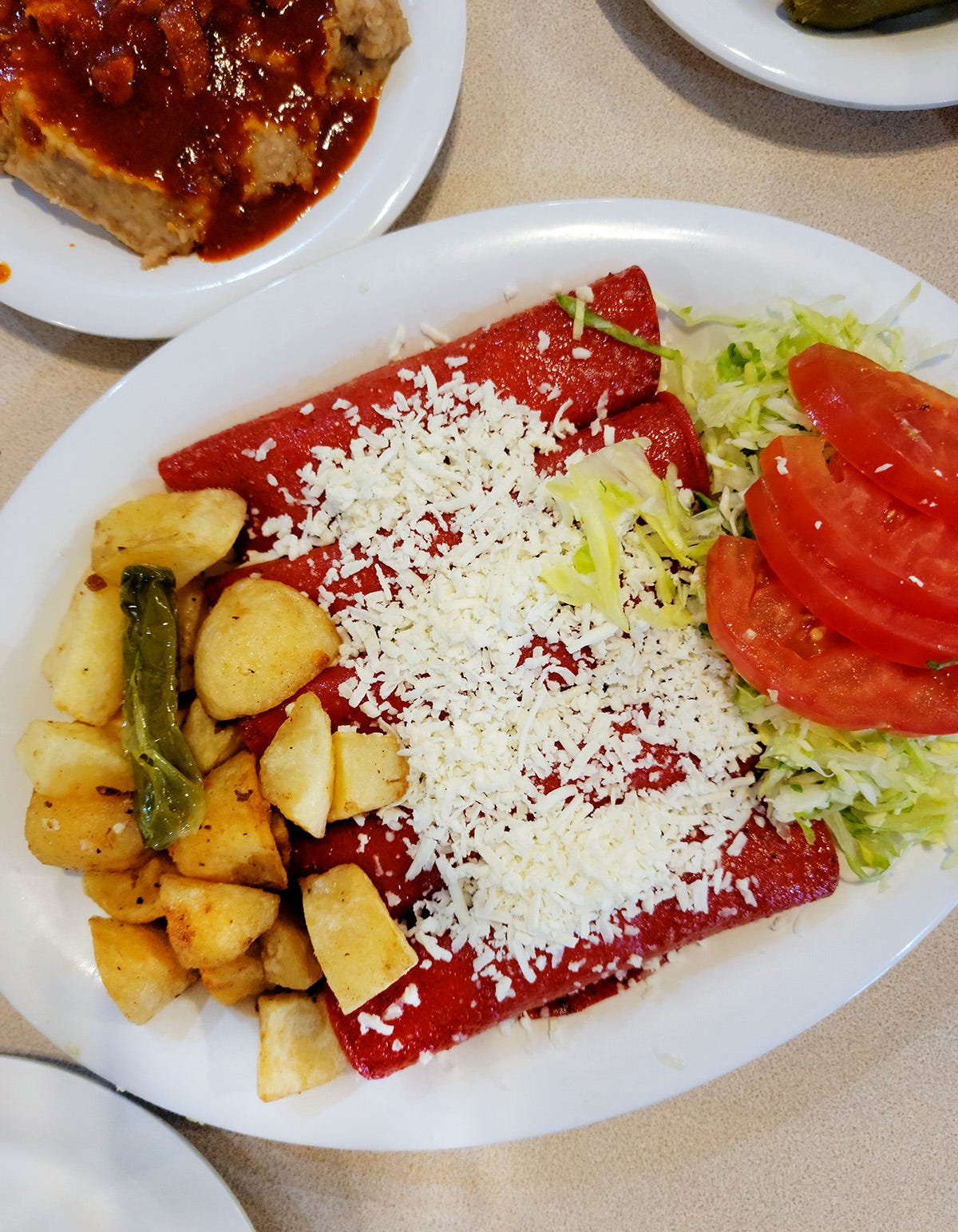 A platter of Monterrey style enchiladas. 