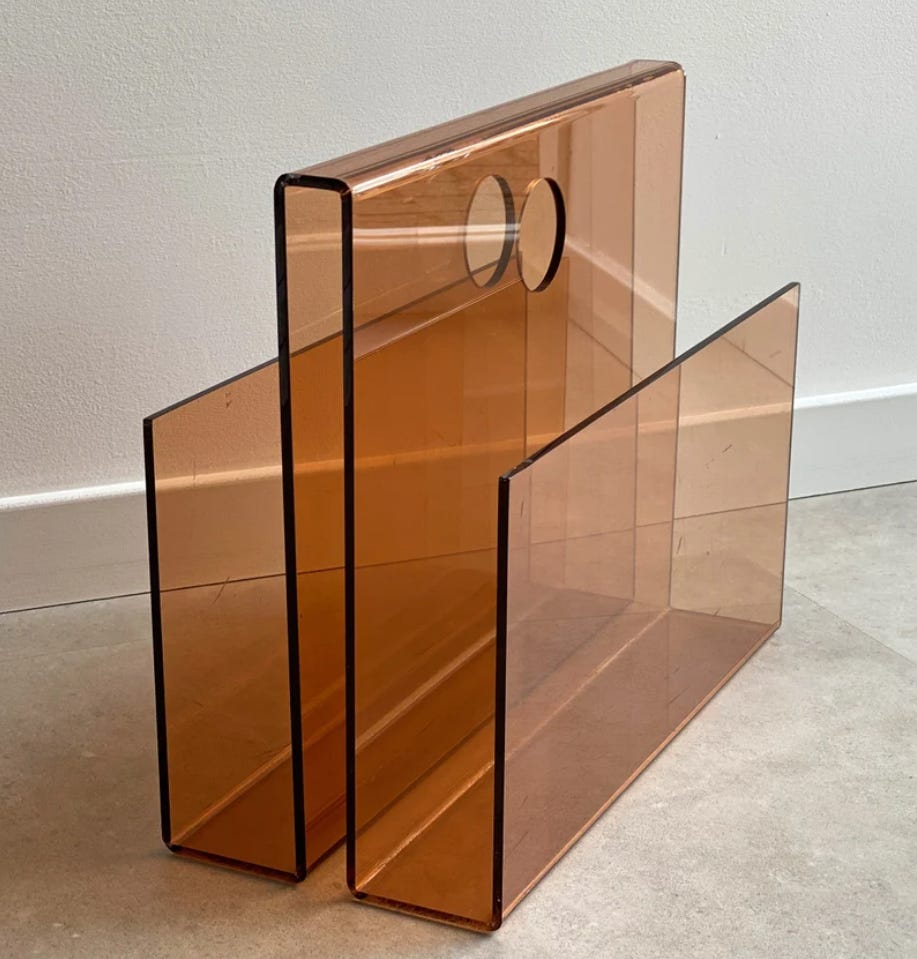 A brown space age acrylic magazine rack