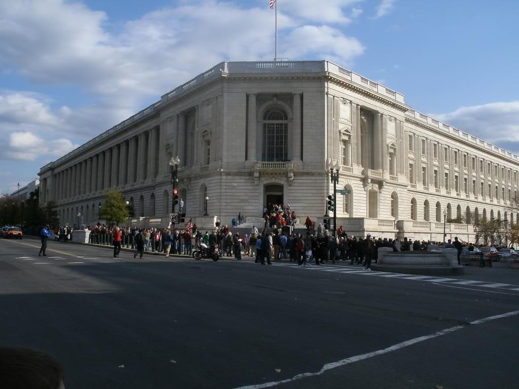 A line of people waited to get through security at one of the entrances of the Cannon House Office Building.