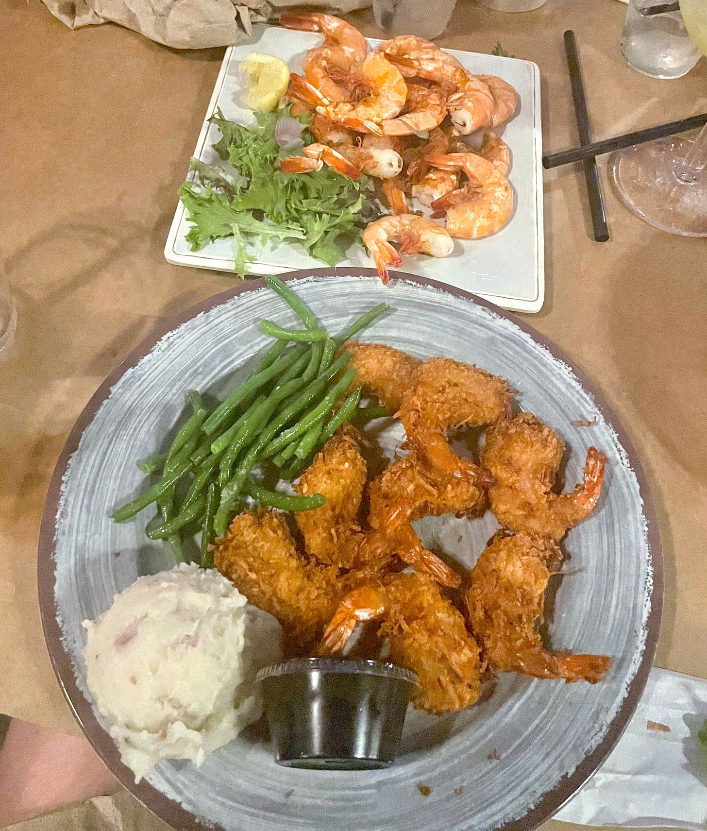 coconut shrimp with green beans and mashed potatoes and plate of steamed shrimp