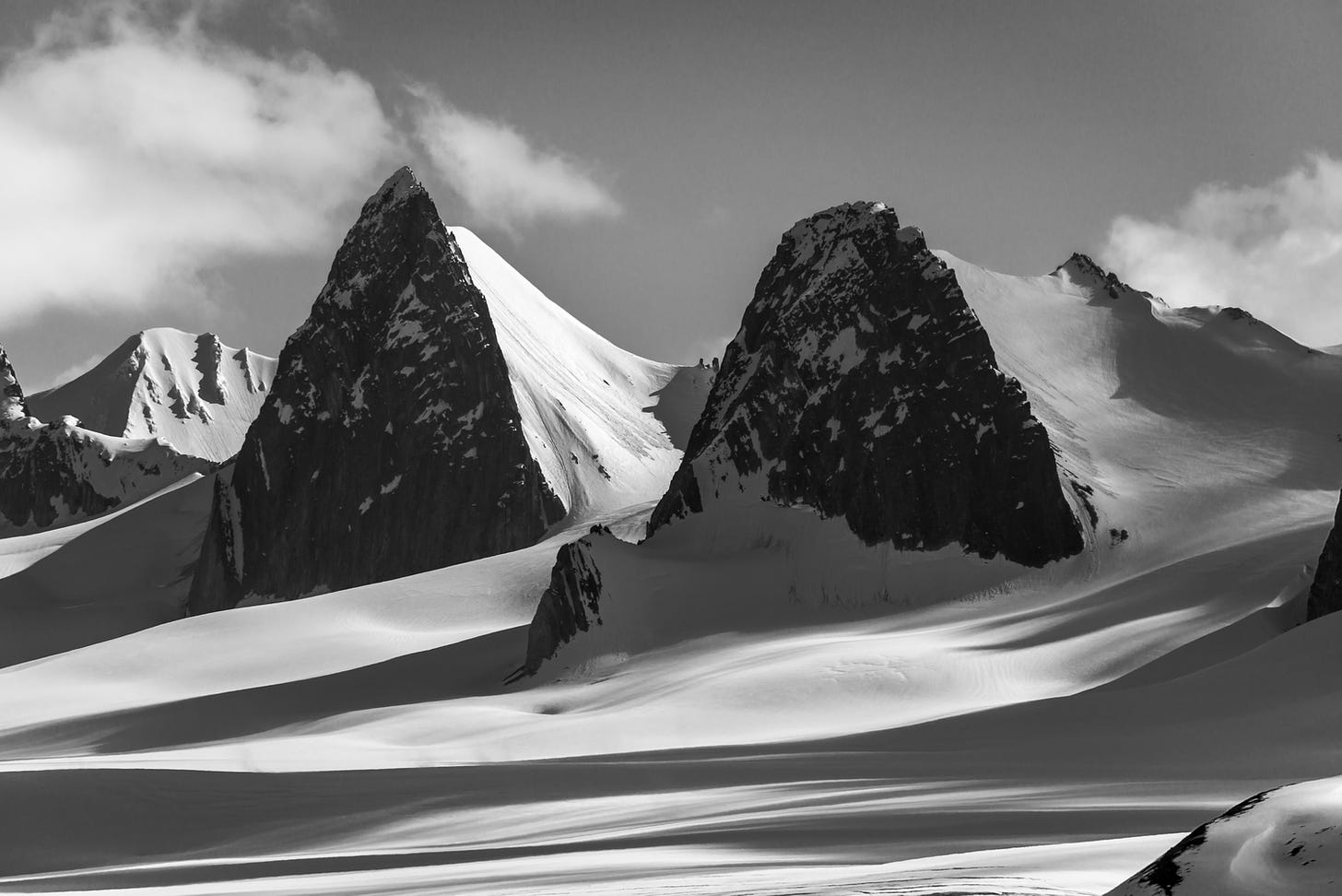 Black and white cliffs on snowy glacier