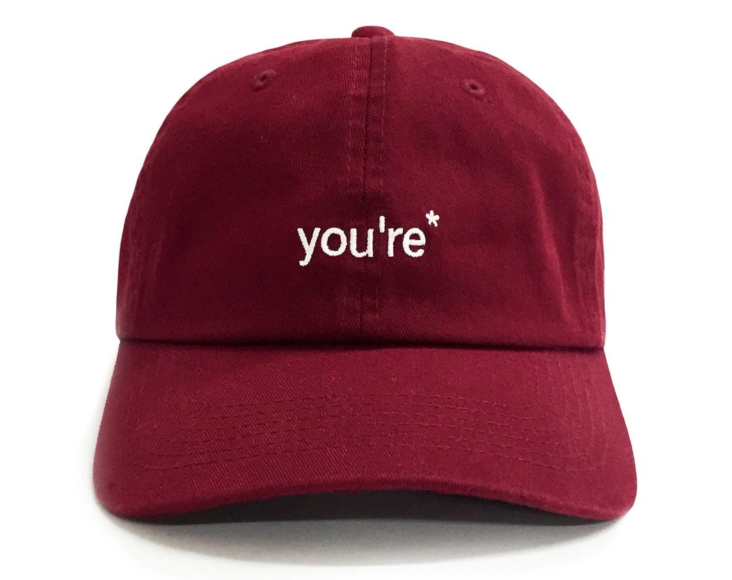 Red hat that says `You're*'