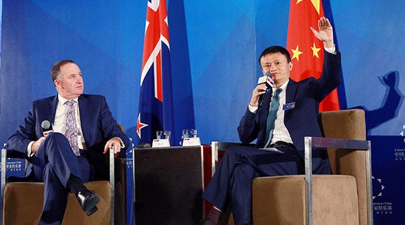 Alibaba founder Jack Ma 马云 hails a deal with New Zealand as PM Keys looks on 