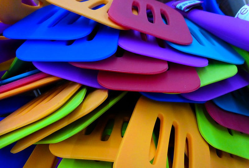 A pile of brightly coloured plastic turners