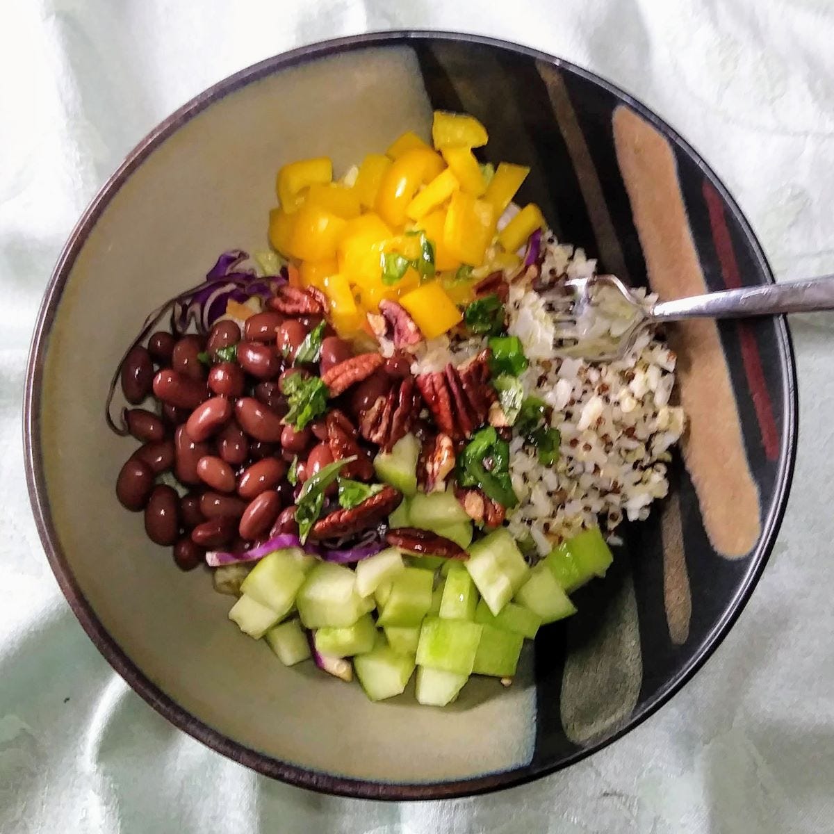 salad with beans, quinoa, pecans, and peppers