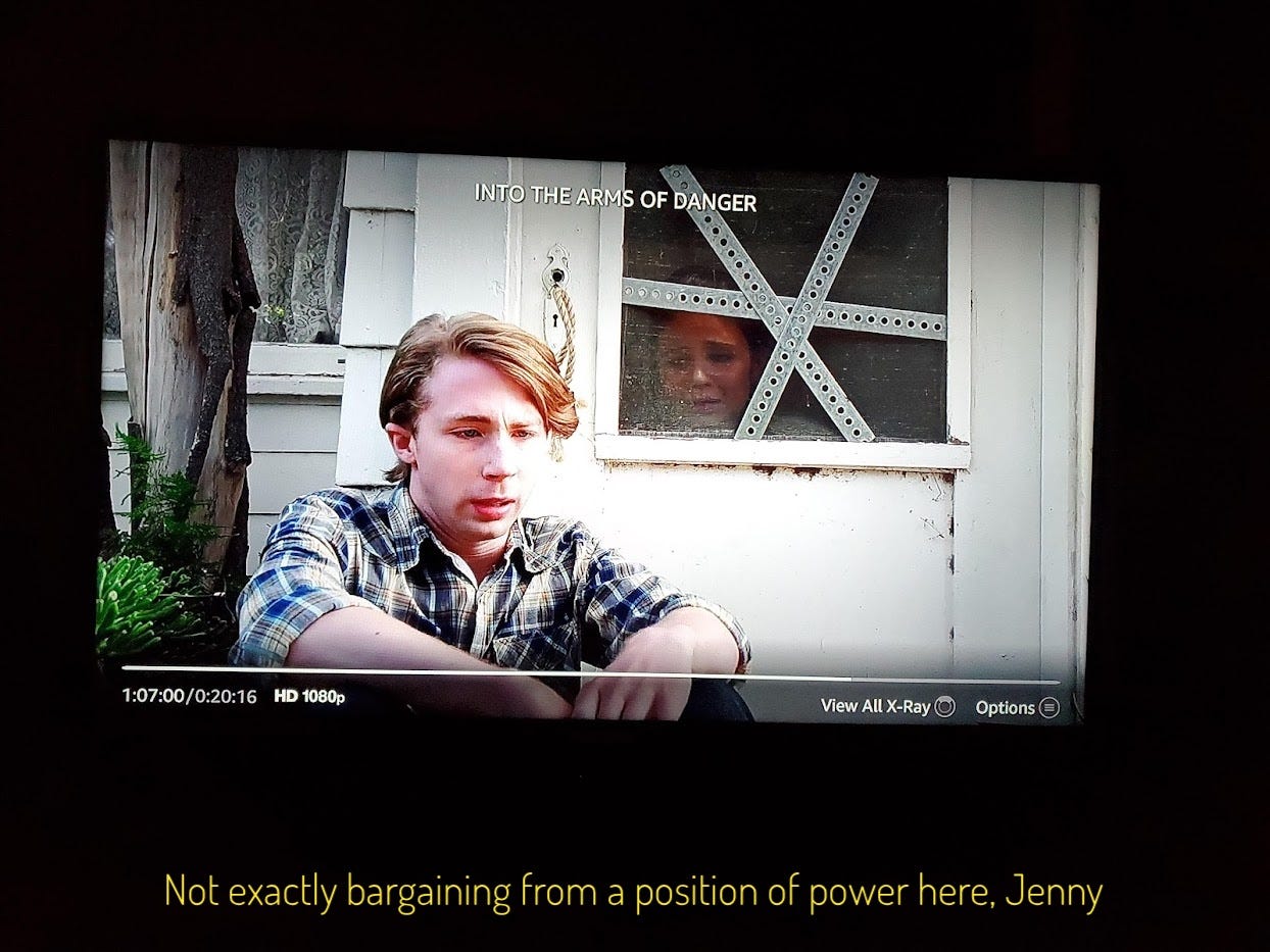 Guy sitting on the ground outside the storm door while Jenny pleads with him, captioned "Not exactly bargaining from a position of power here, Jenny"