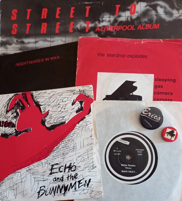 A selection of record sleeves and badges