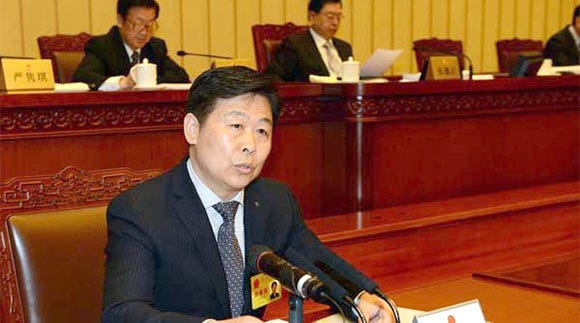NPC deputy cheif Xu Xianming briefs the session on the last draft of the Foreign NGO Activity Management Law