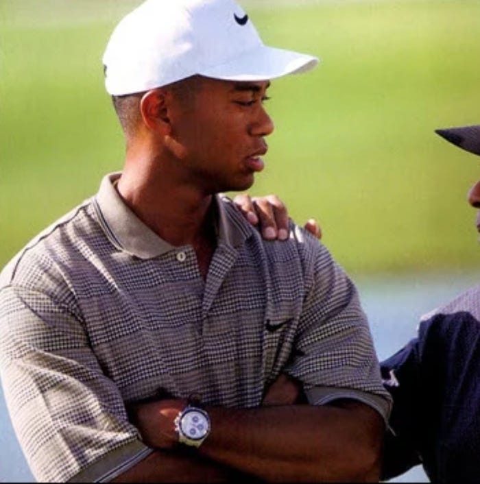 A younger Tiger Woods wearing a limited edition “Tudor Tiger” chronograph