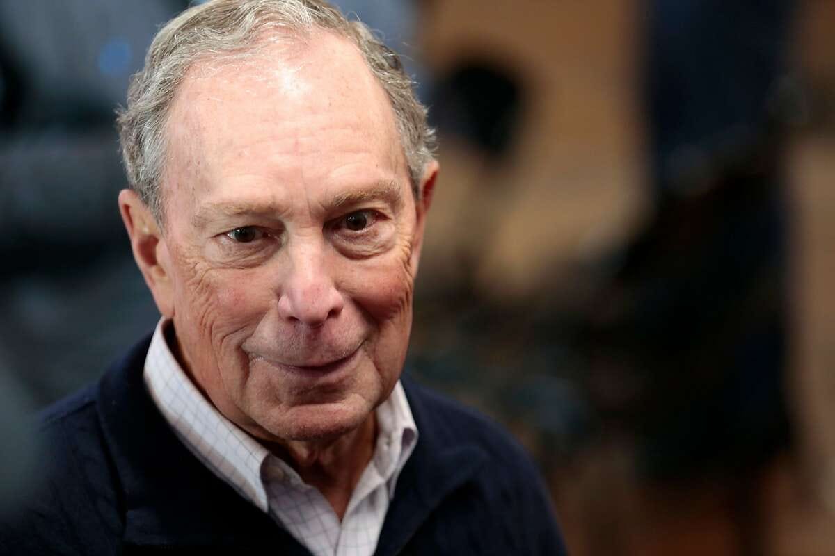 In this file photo taken on Dec. 21, 2019, 2020 Democratic presidential hopeful and former New York Mayor Michael Bloomberg talks to reporters after an event in Detroit, Mich.