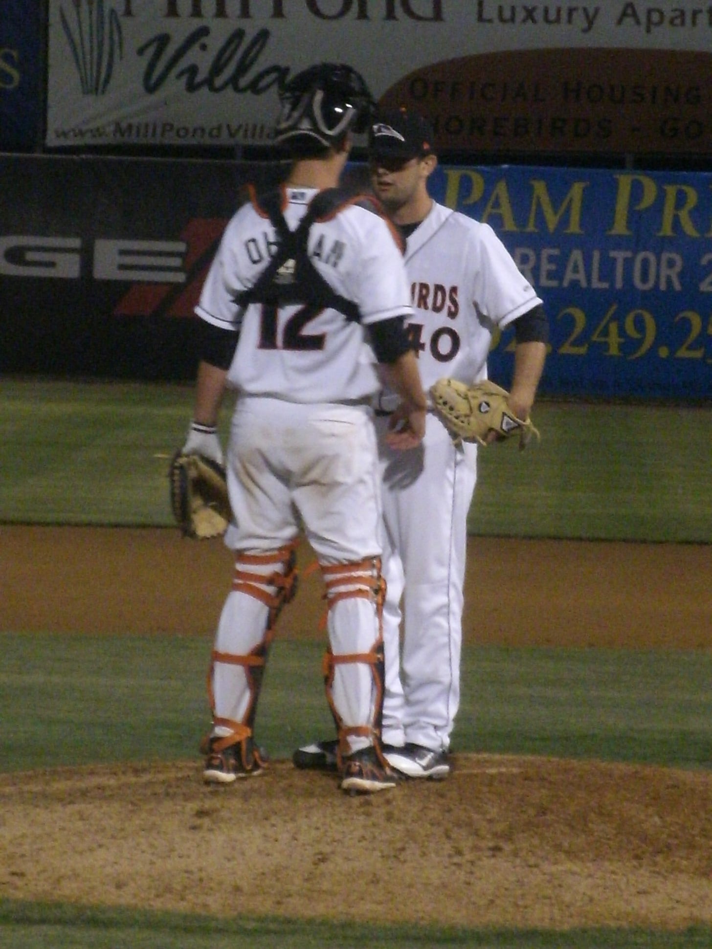 David Walters is instructed by catcher Michael Ohlman before taking the mound and earning the save against Savannah April 27.