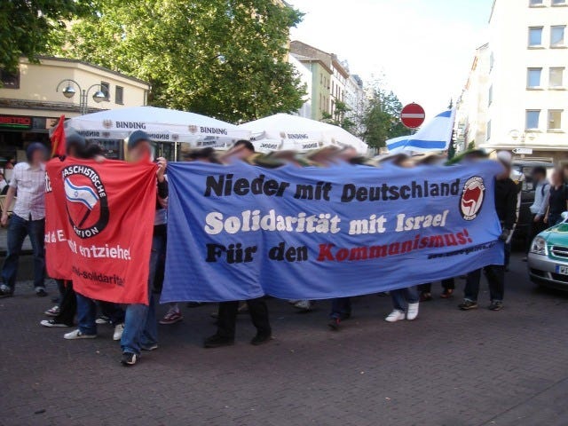 Banner in German which reads “Down with Germany! Solidarity with Israel! For Communism!”
