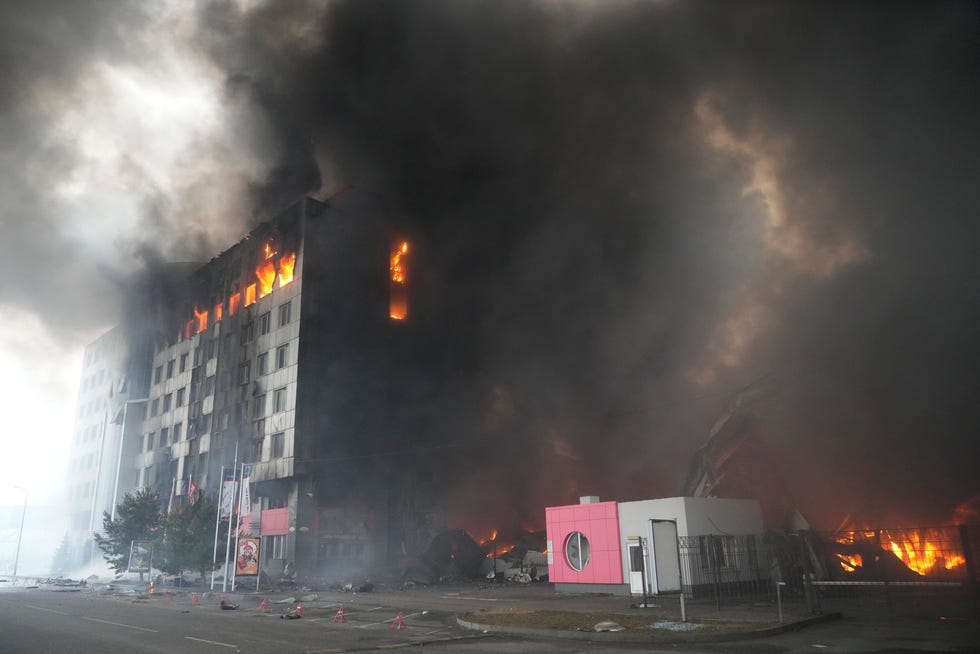 A building burns after shelling in Kyiv, Ukraine, Thursday, March 3, 2022. Russian forces have escalated their attacks on crowded cities in what Ukraine's leader called a blatant campaign of terror.