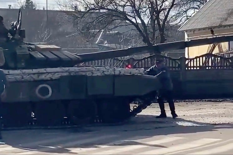 The video shows unnamed men confronting a line of invading Russian tanks.