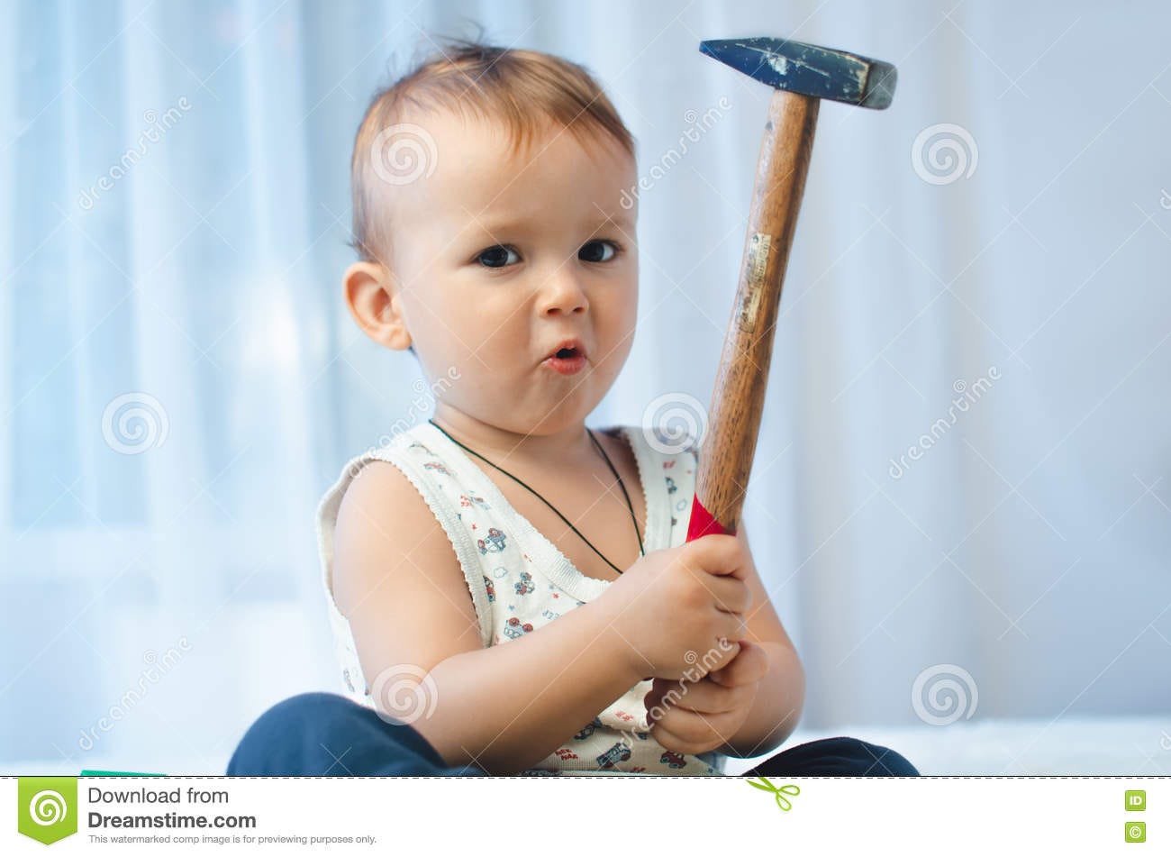 The Child Sits with a Hammer Stock Photo - Image of surprise, cute: 82088372