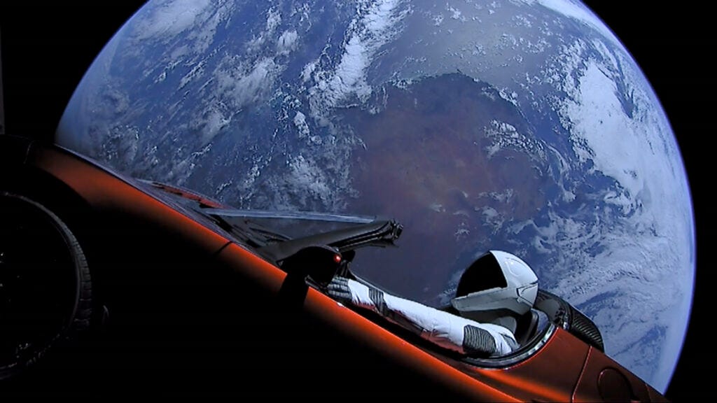 The Tesla floating in space.