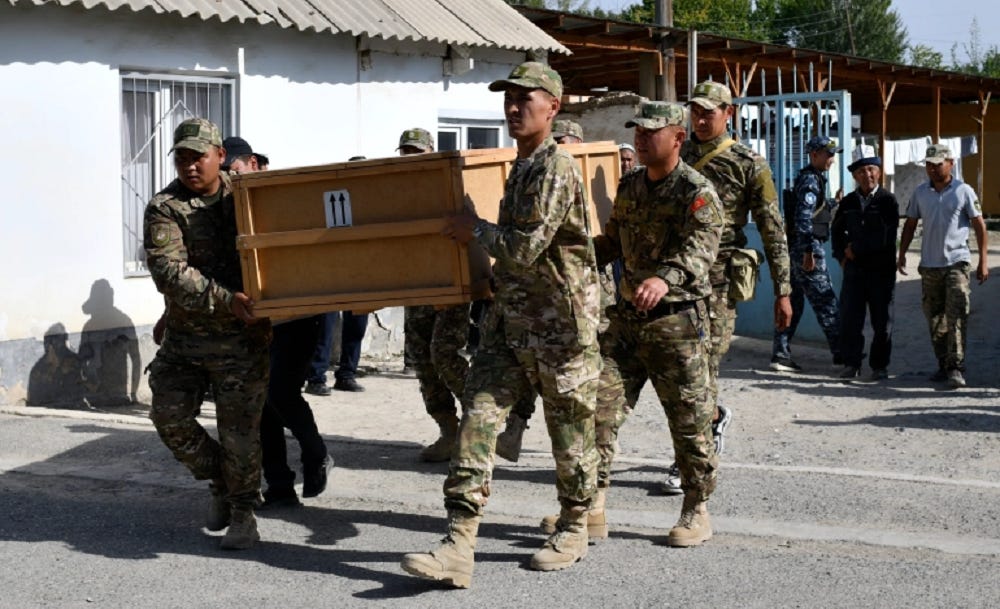 A group of soldiers carrying a coffin

Description automatically generated with low confidence