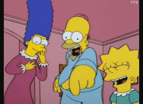 A gif of Homer system pointing and laughing with Marge and Lisa laughing as well.