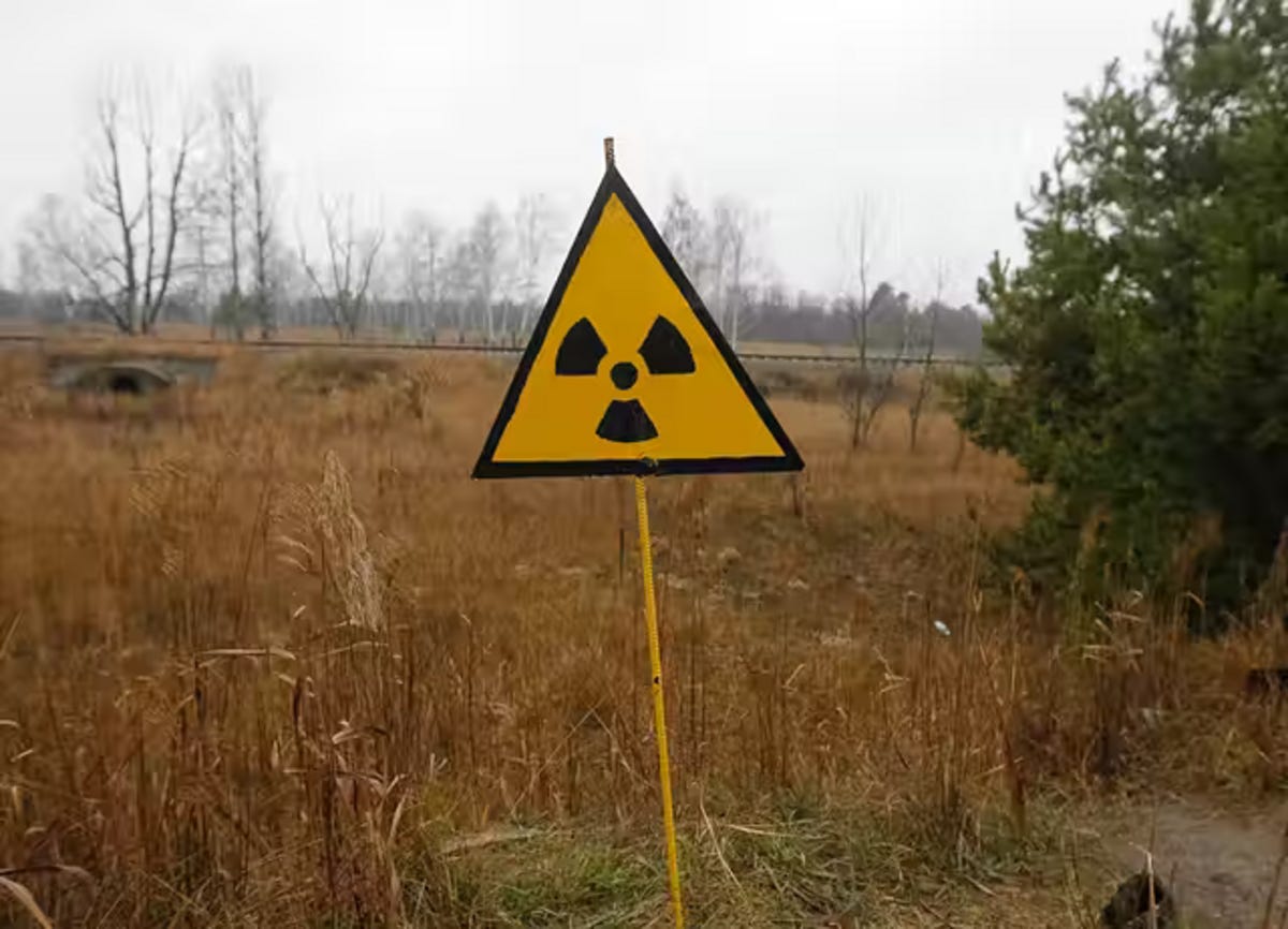A yellow sign in a field

Description automatically generated with medium confidence