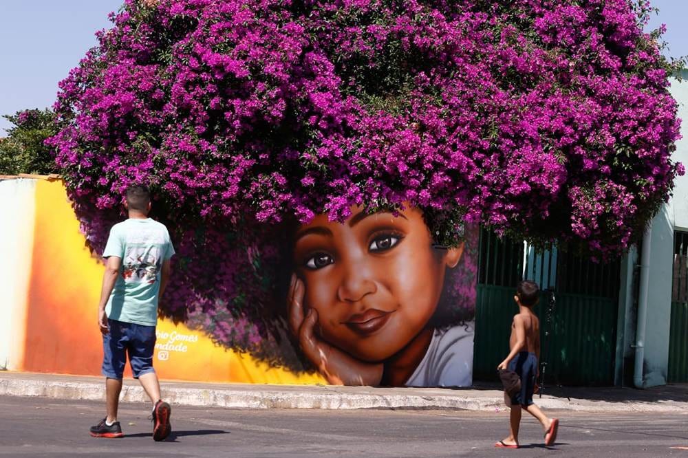 wall mural of little girl with lilac flowers for her hair