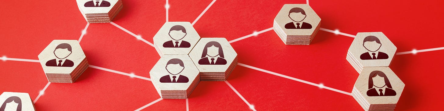 Illustration of people, represented by hexagonal wooden tiles, connected against a red background