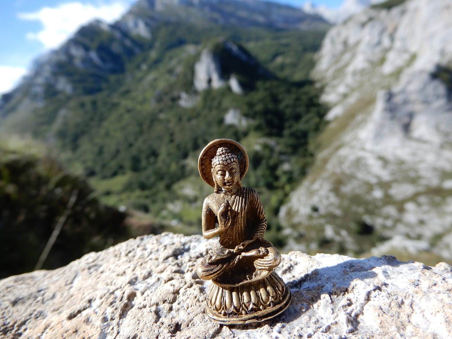 Tiny Buddha on mountain top