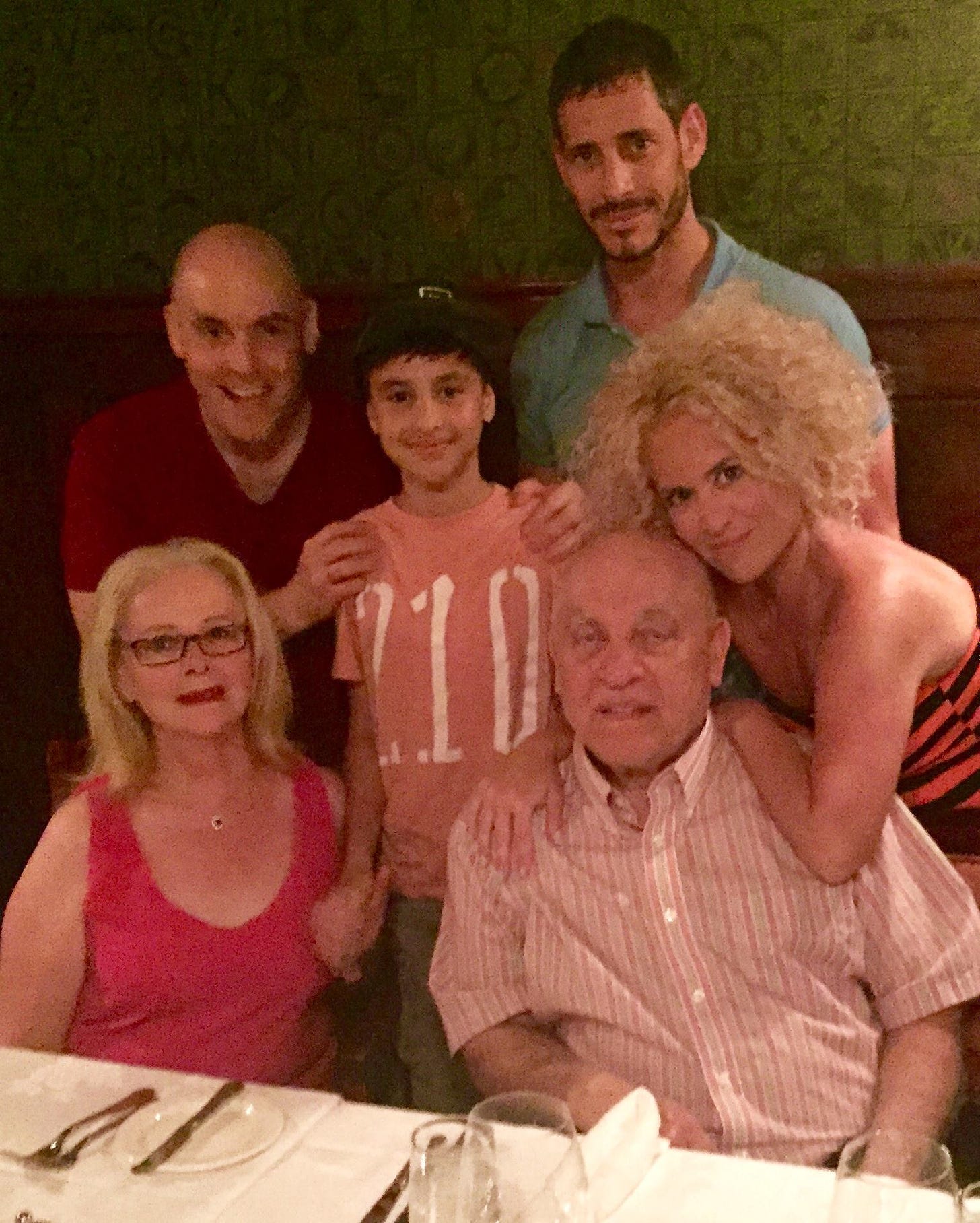 A picture of Dahlia's family. And she explains: Our last family photo - and first family photo - is from 2015. That’s my nephew in the middle. Five of the six people in this photo are vegan or vegetarian. This is the night we went to the steak house. No food for me, thank you. I was a Cosmopolitarian that night.