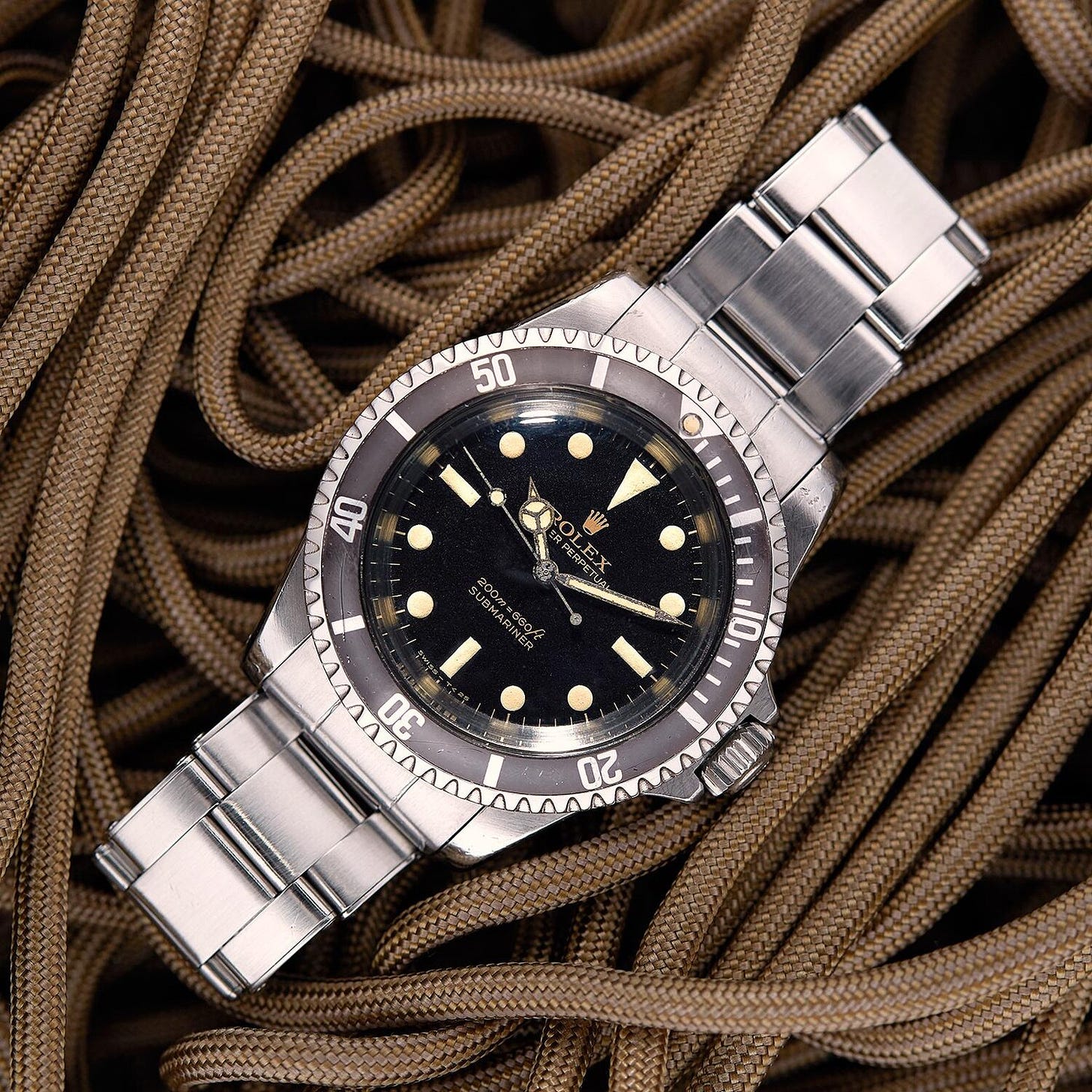 A gilt dial reference 5513 “Bart Simpson”. The 5513 in particular illustrates the evolution of the Submariner form the 60s through the 80s, starting with these glossy gilt dials, and ending with the glossy black dials of the 1980s. |  Saga Trading Co.