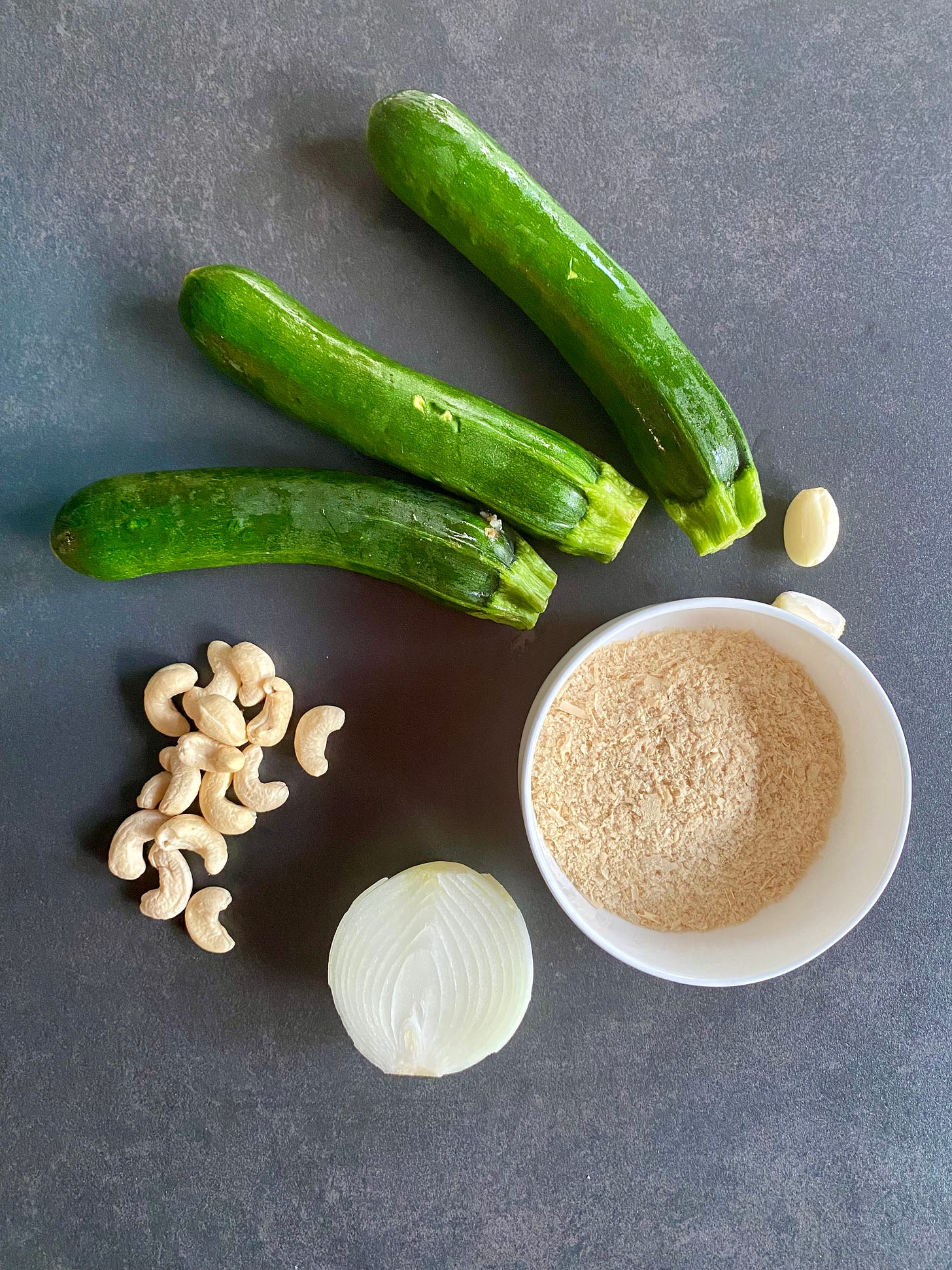Zucchini, garlic, onion, nutritional yeasts, cashew nuts, ingredients for a soup