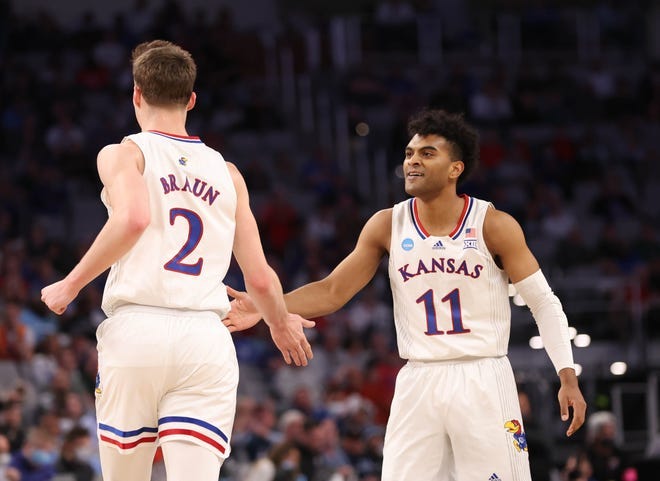 Kansas Jayhawks guard Remy Martin (11) and Kansas Jayhawks guard Christian Braun (2) celebrate against the Creighton Bluejays during the second round of the 2022 NCAA Tournament at Dickies Arena.